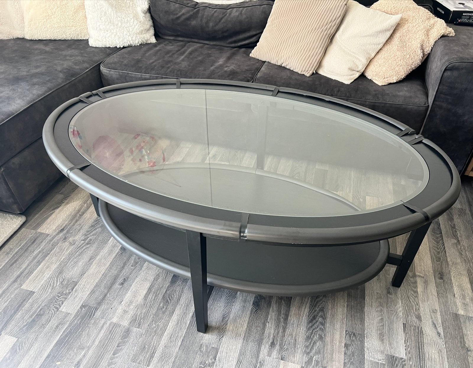 Ovale IKEA salontafel met glazen blad en zwart houten frame, Ophalen, Gebruikt, 100 tot 150 cm, 50 tot 100 cm