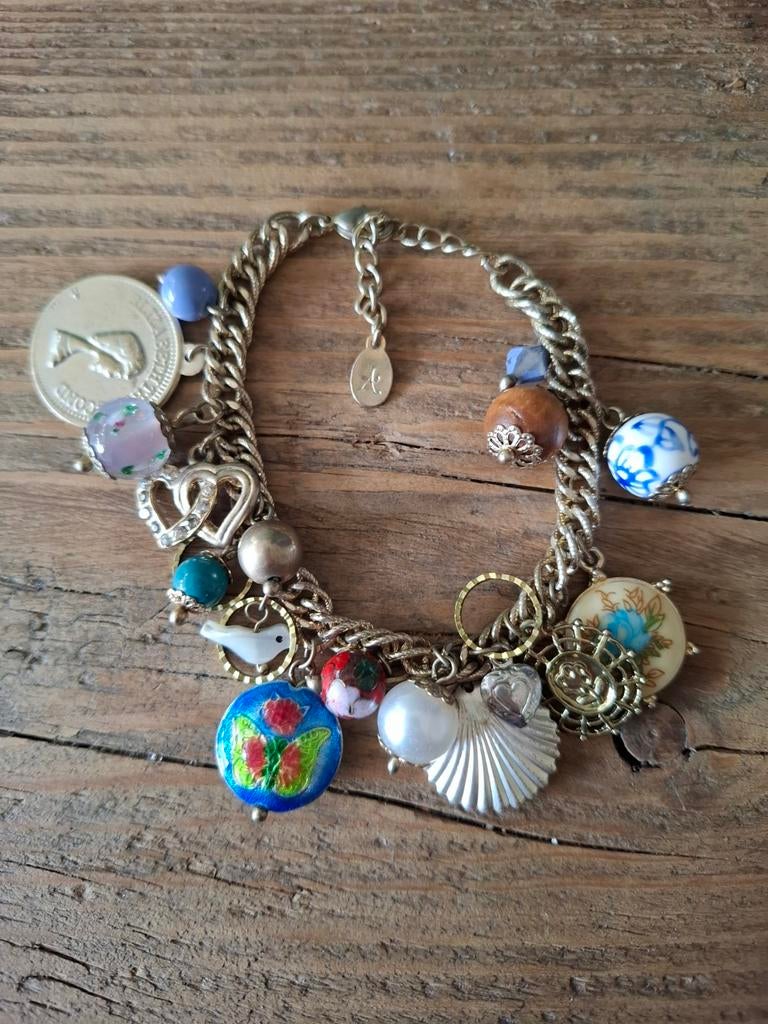 Volle bedelarmband van Accessorize. Goudkleurig. Max 22 cm., Sieraden, Tassen en Uiterlijk, Armbanden, Ophalen of Verzenden, Zo goed als nieuw