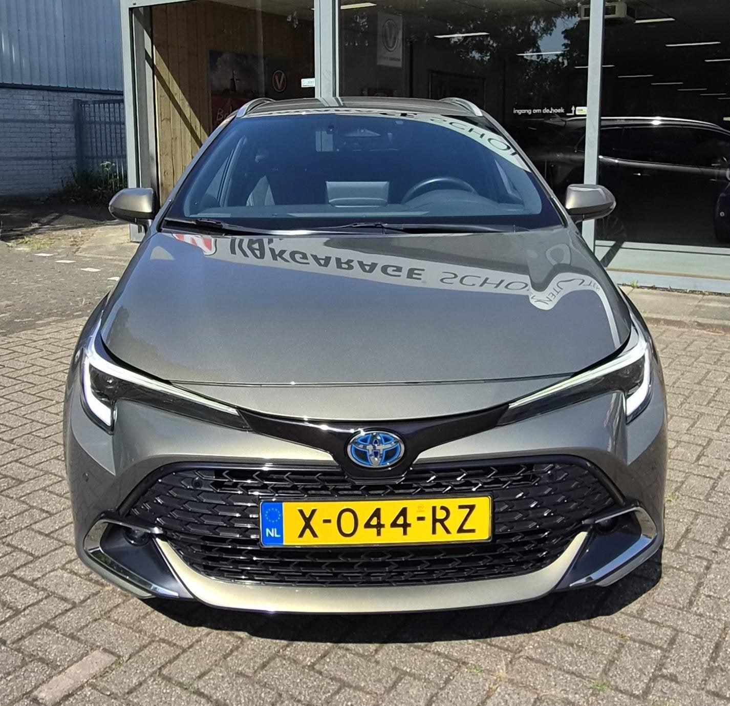 Toyota Corolla TS 2.0 Hybrid Business Plus, Gebruikt, 4 cilinders, Leder en Stof, 1415 kg