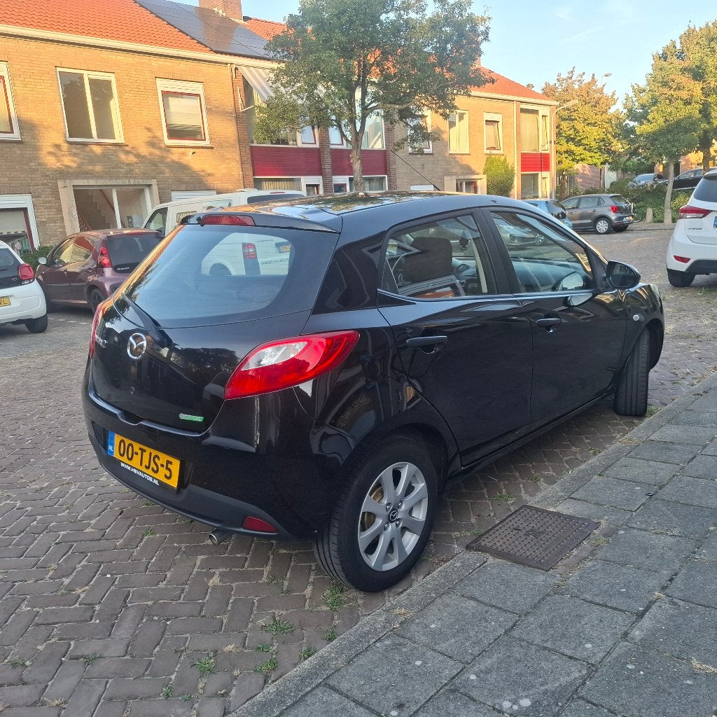 Mazda 2 1.3 Bifuel 75pk 5D 2012 Zwart, Auto's, Mazda, Voorwielaandrijving, Euro 5, 4 cilinders, Zwart