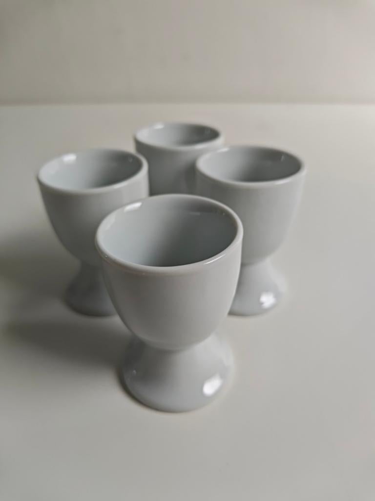 Set van 4 witte eierdopjes, Overige typen, Ophalen of Verzenden, Zo goed als nieuw, Steen/keramiek