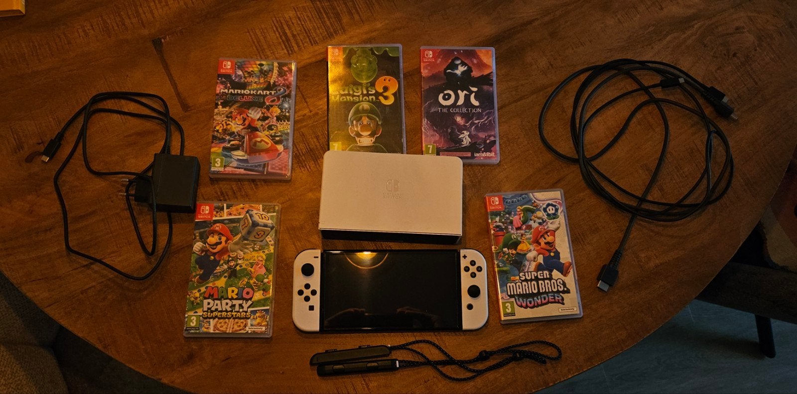 Nintendo Switch OLED met 5 games en accessoirs
