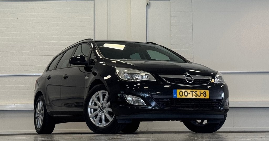 Opel Astra Sports Tourer 1.4 Turbo Edition Navigatie CruiseC, Voorwielaandrijving, Euro 5, Stof, Gebruikt