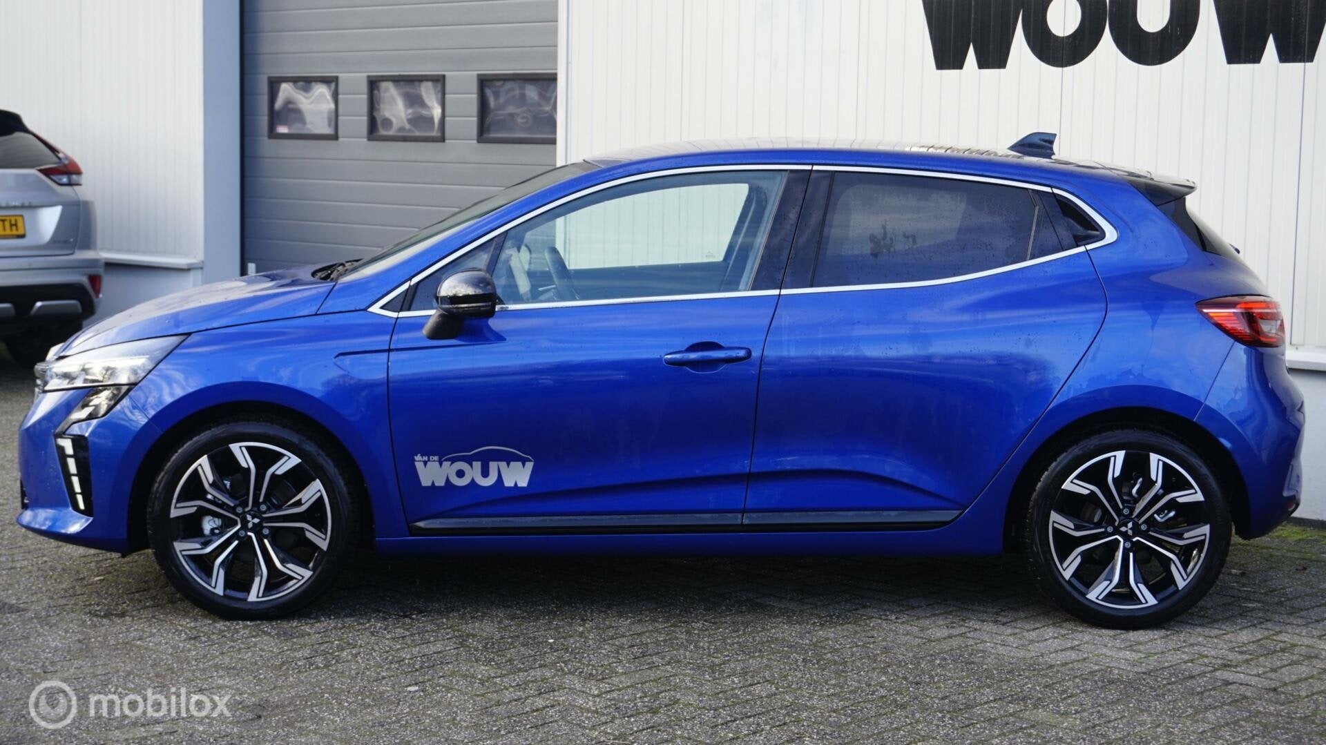 Mitsubishi Colt 1.6 HEV First Edition, 12 maanden, Gebruikt, 4 cilinders, Blauw