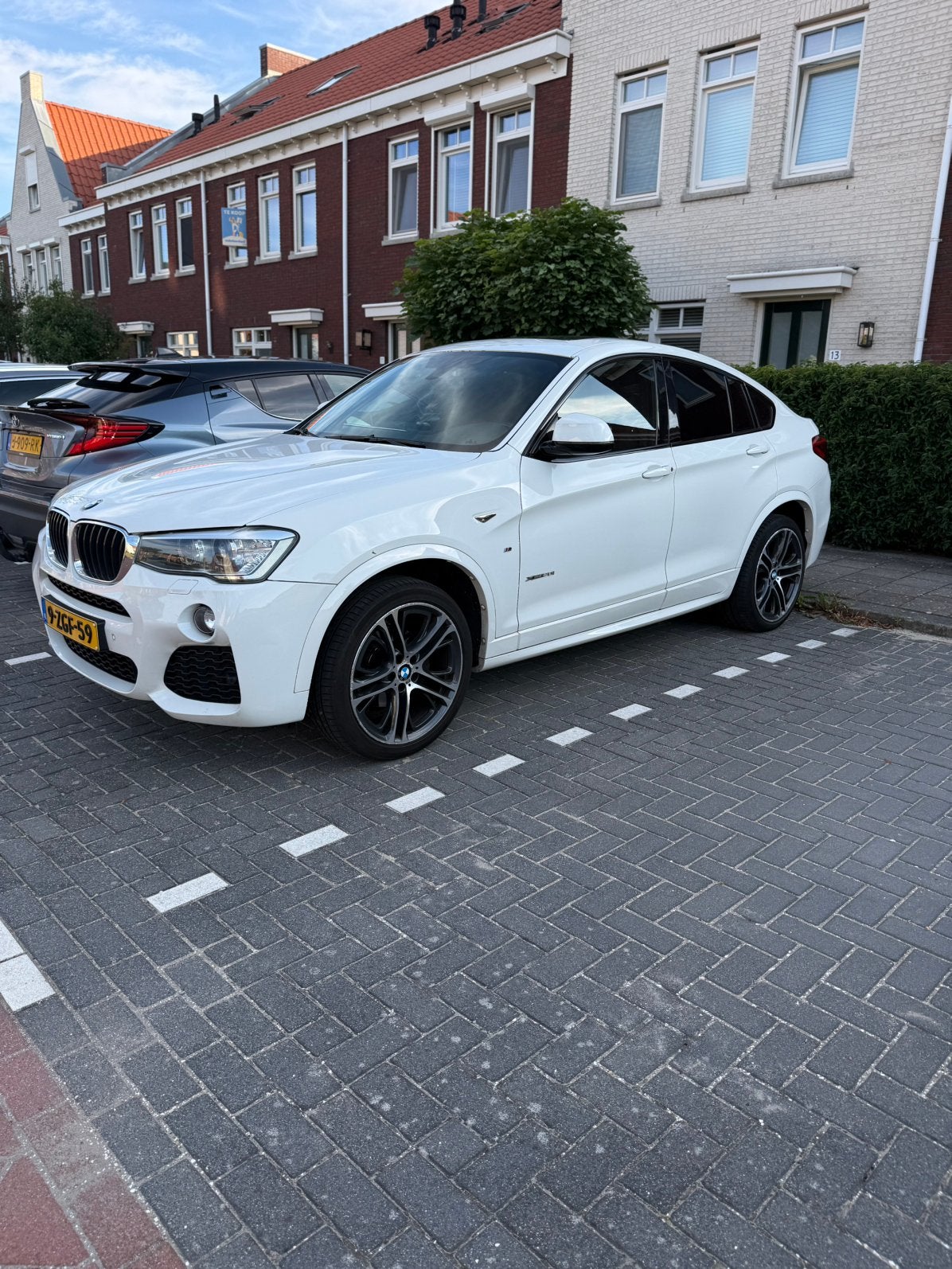 BMW X4 xDrive20i M Sport | Pano | Leder | Navi | NL-auto, Auto's, Zwart, 4 cilinders, 2000 kg, Wit