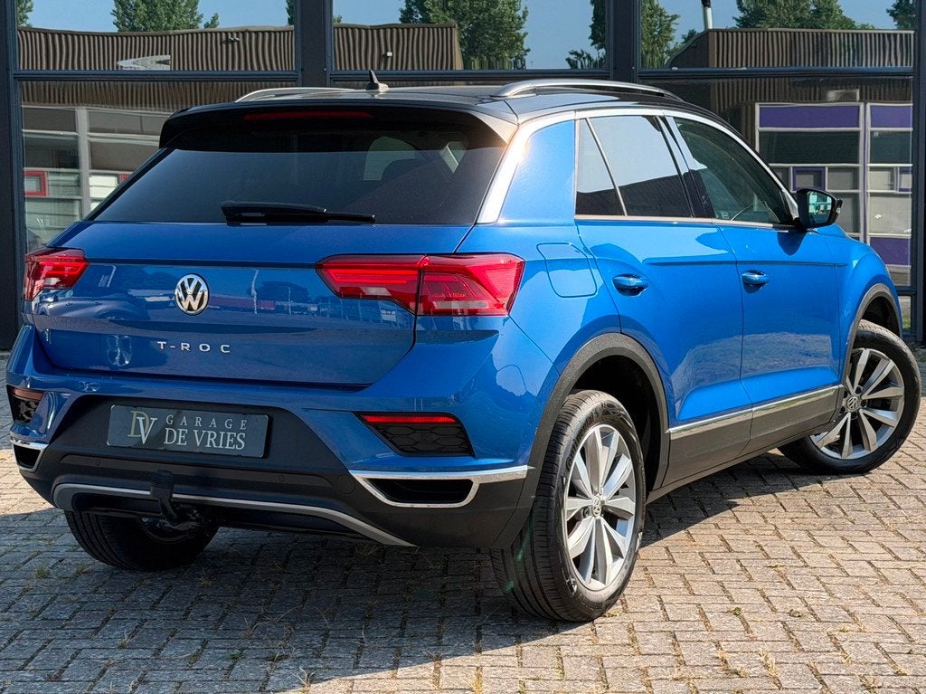 Volkswagen T-Roc 1.5 TSI Style ACC CarPlay Navi Trekhaak Gar, Auto's, Volkswagen, Voorwielaandrijving, Stof, 4 cilinders, 150 pk