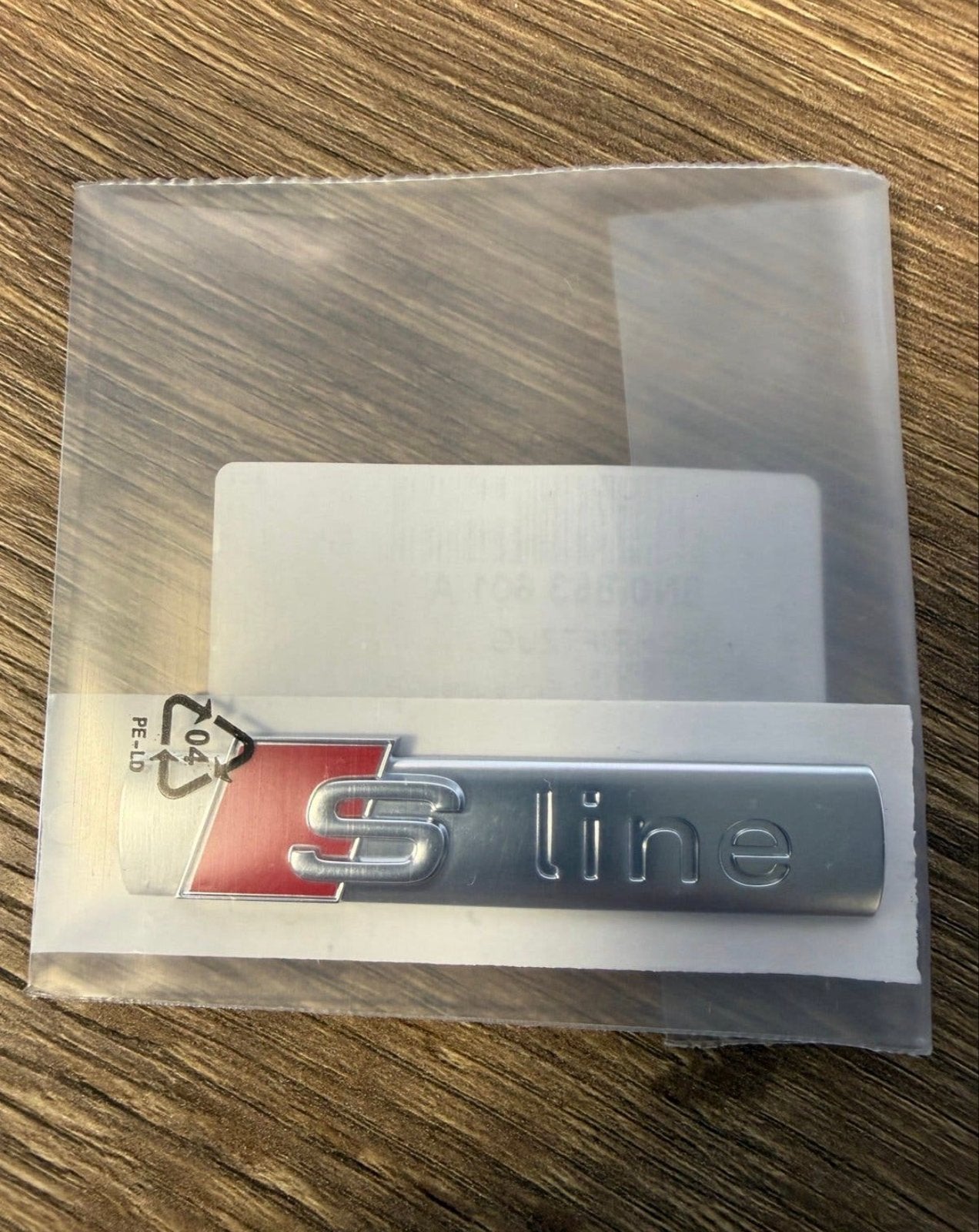 Origineel Audi S-Line embleem nieuw, Ophalen of Verzenden, Nieuw, Audi