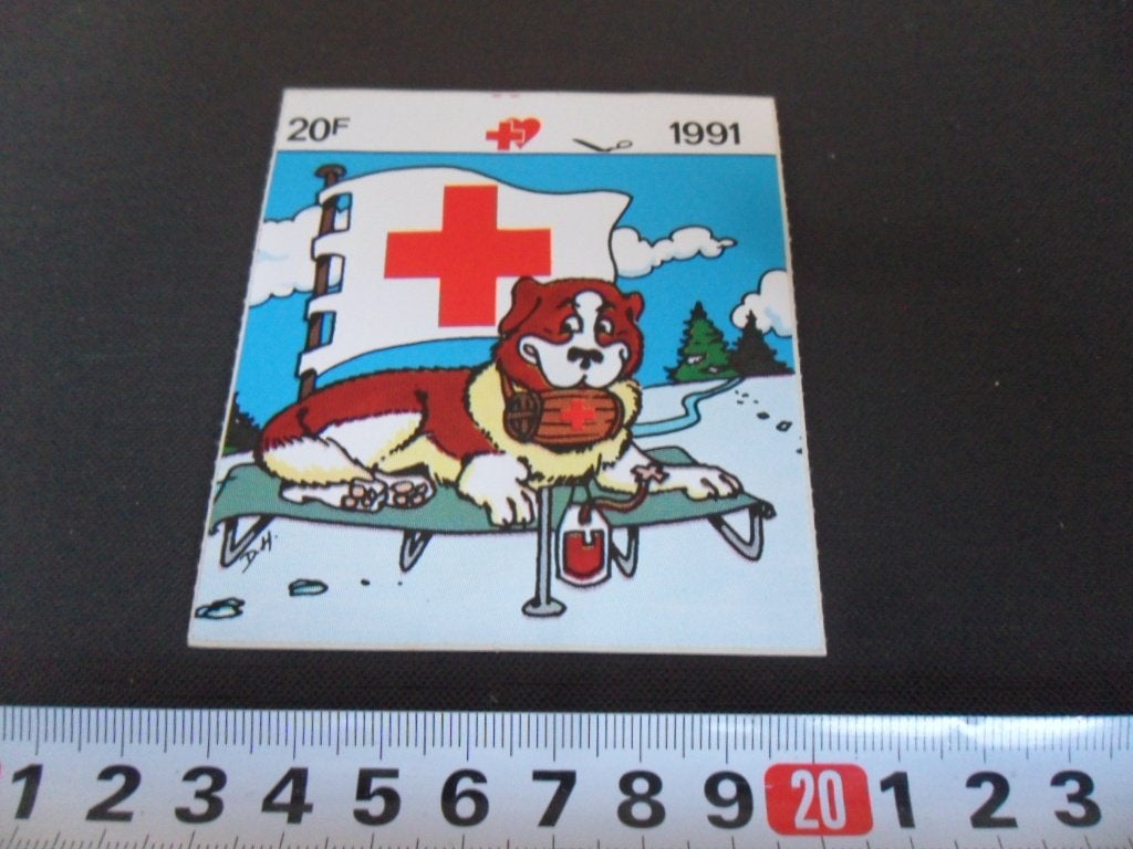sticker Rode Kruis 1991 strip Hond Vlag, Ophalen of Verzenden, Zo goed als nieuw