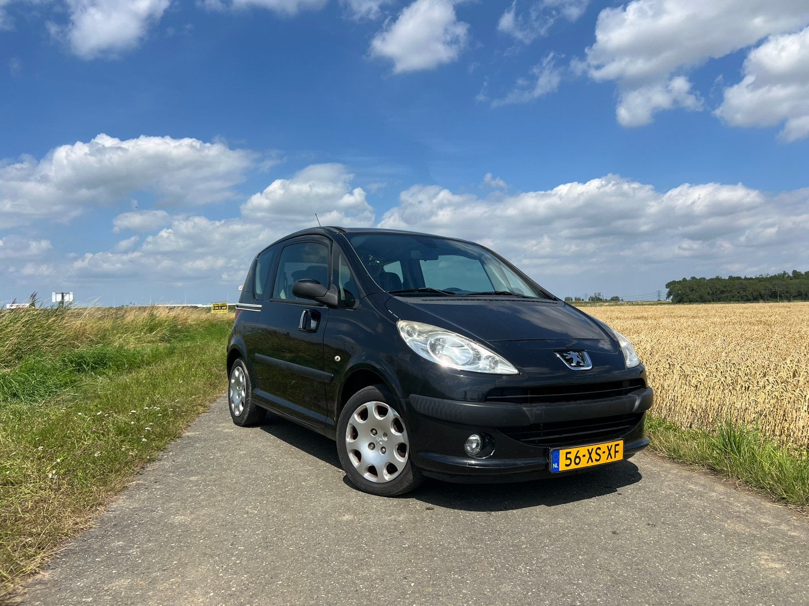 Peugeot 1007 1.4 2007 Zwart - Nieuwe APK!, Auto's, Voorwielaandrijving, 1360 cc, 4 cilinders, 4 stoelen