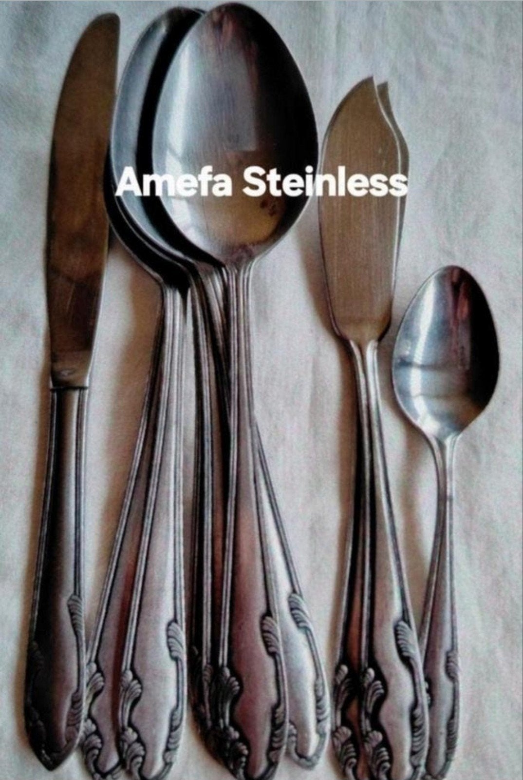 Bestek Amefa Stainless bestek relief barokke krullen, Ophalen of Verzenden, Nieuw, Rvs of Chroom
