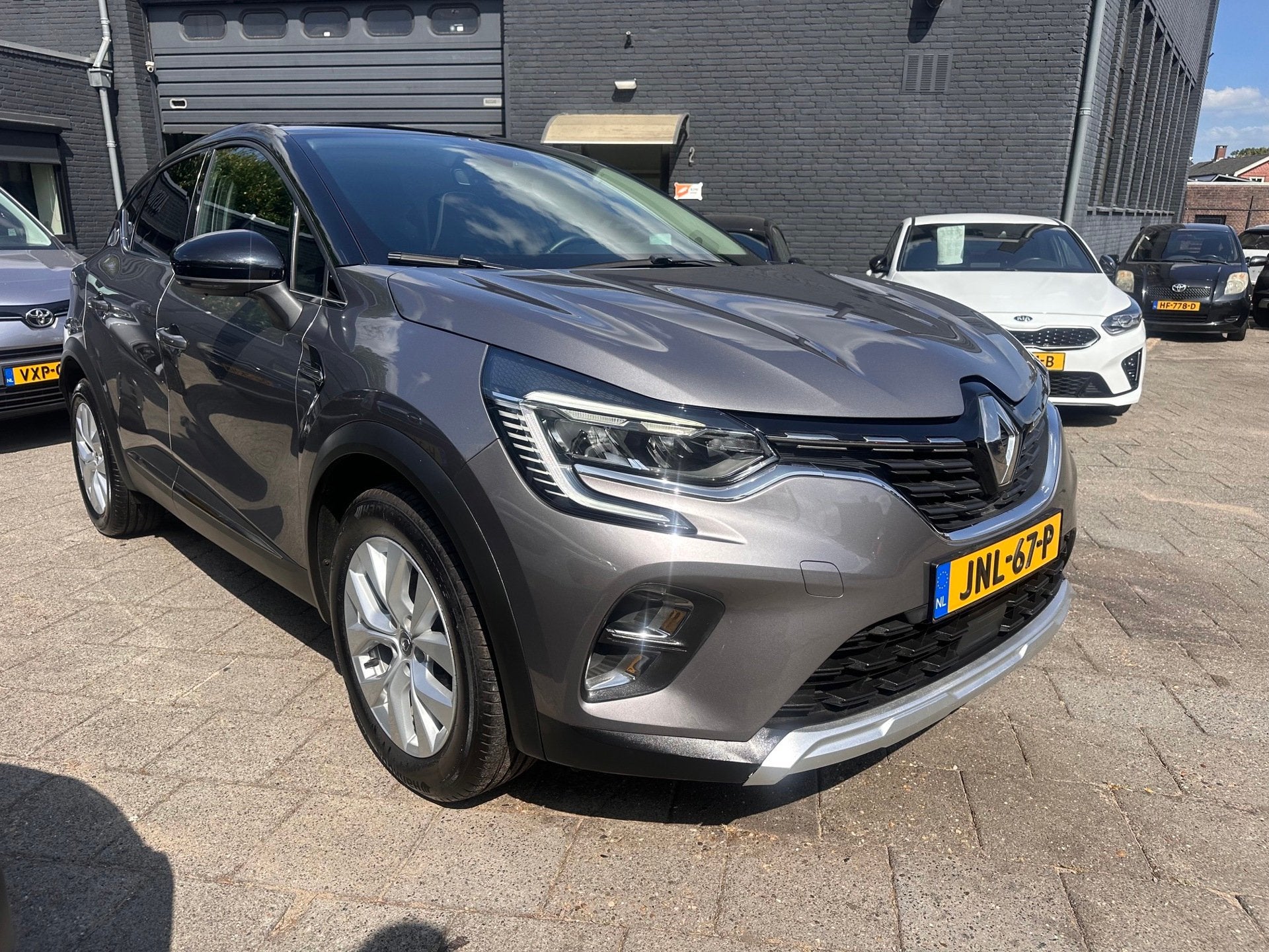 Renault Captur 1.0 TCe Intens|91pk|Navi|Clima|Panodak, Auto's, Voorwielaandrijving, Gebruikt, Zwart, Leder en Stof