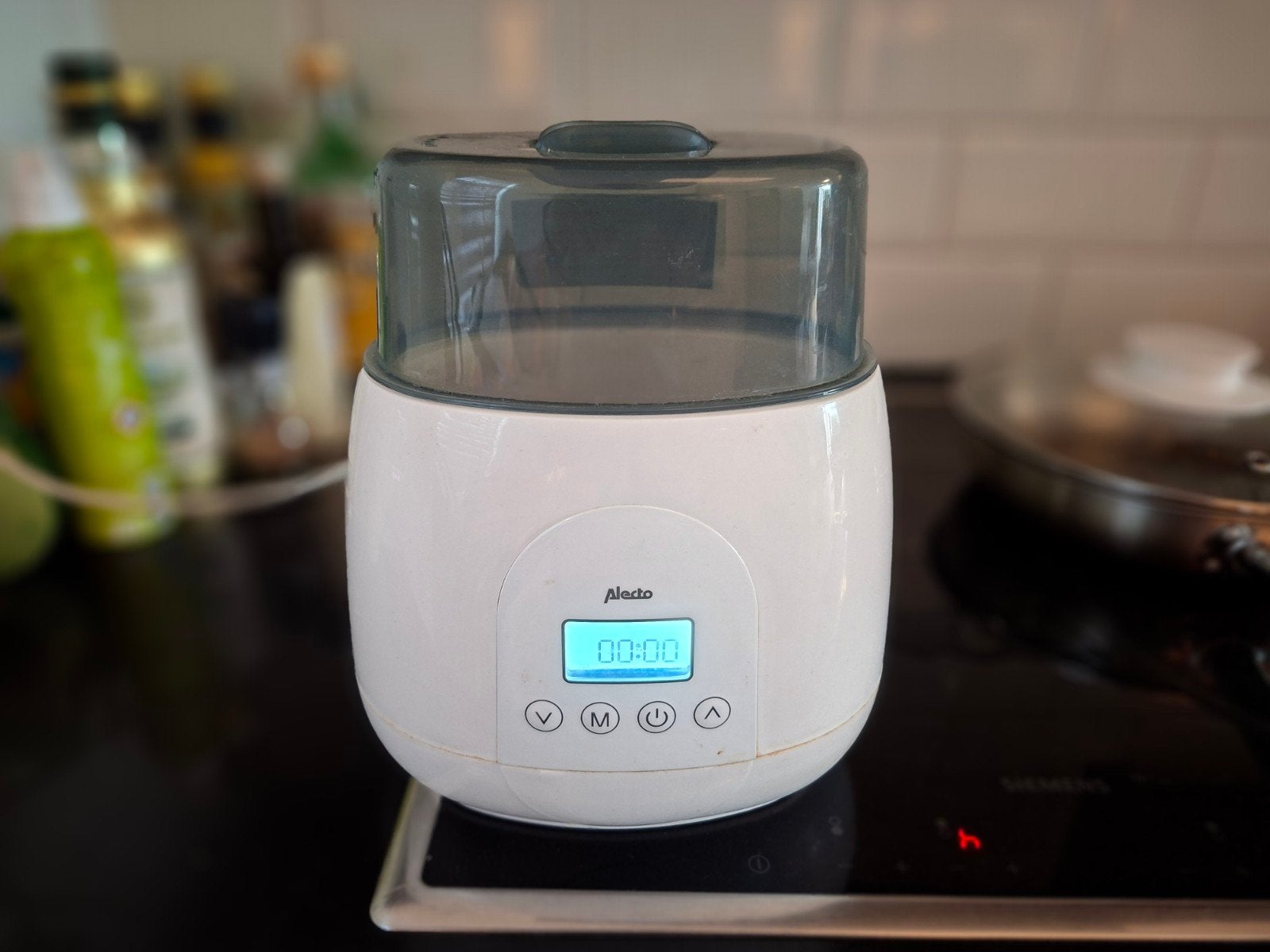 Flessenreiniger/sterilisator voor babyflessen, Ophalen