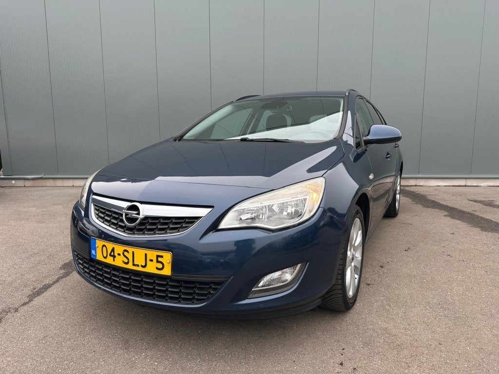 Opel Astra Sports Tourer 1.4 Turbo Edition ONDERHOUDSBOEKJE, Auto's, Euro 5, 15 km/l, 4 cilinders, Blauw