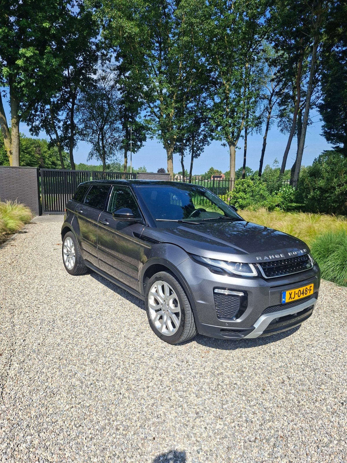Land Rover Range Rover Evoque 2.0 SI4 4WD AUT 2015 Grijs, Auto's, 1800 kg, 4 cilinders, Vierwielaandrijving, Particulier