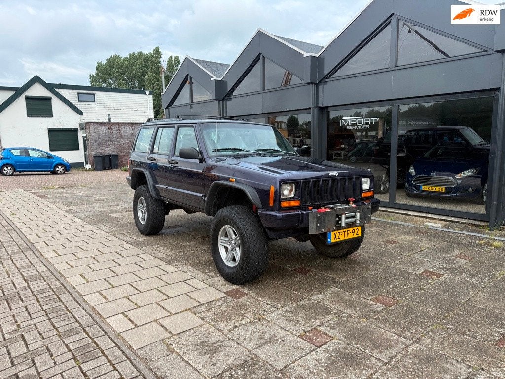 Jeep Cherokee 4.0i Limited, Auto's, Gebruikt, Blauw, 750 kg, 3250 kg