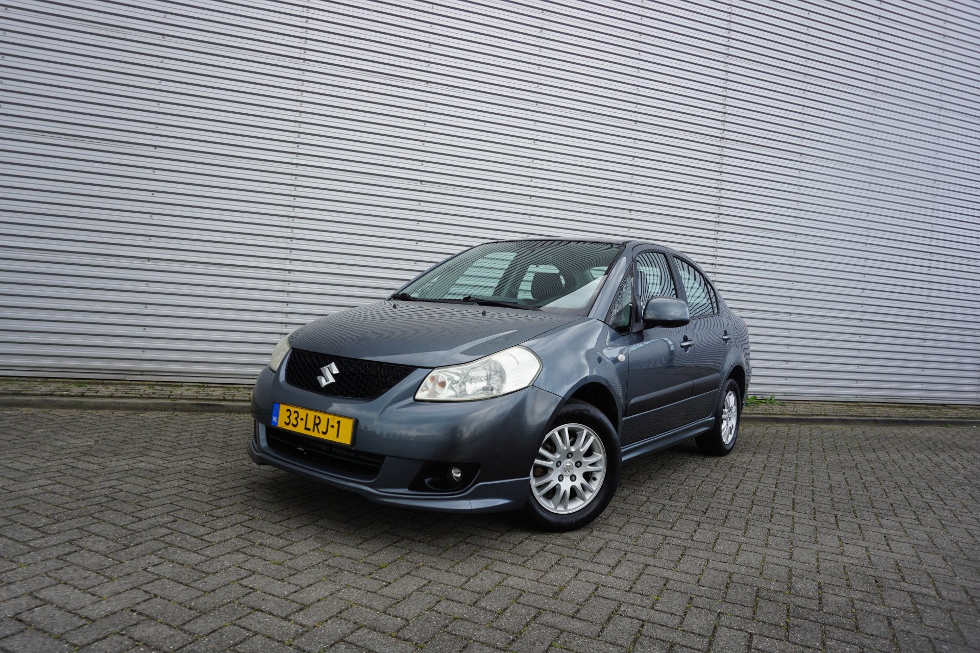 Suzuki SX4 1.6 Exclusive Airco / Elektr. ramen / Parkeersens, Auto's, Elektrische ramen, Gebruikt, 4 cilinders, 49 €/maand