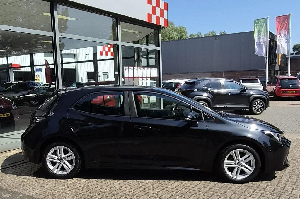 Toyota Corolla Hybrid 140 Active, Auto's, Toyota, Gebruikt, 4 cilinders, Corolla, Zwart