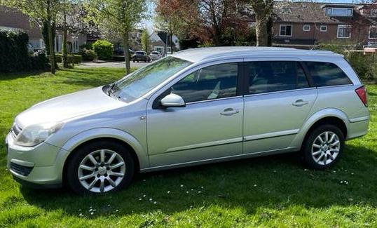 Opel astra station wagon grijs automaat benzine 1.8, Stof, 4 cilinders, Stationwagon, Grijs