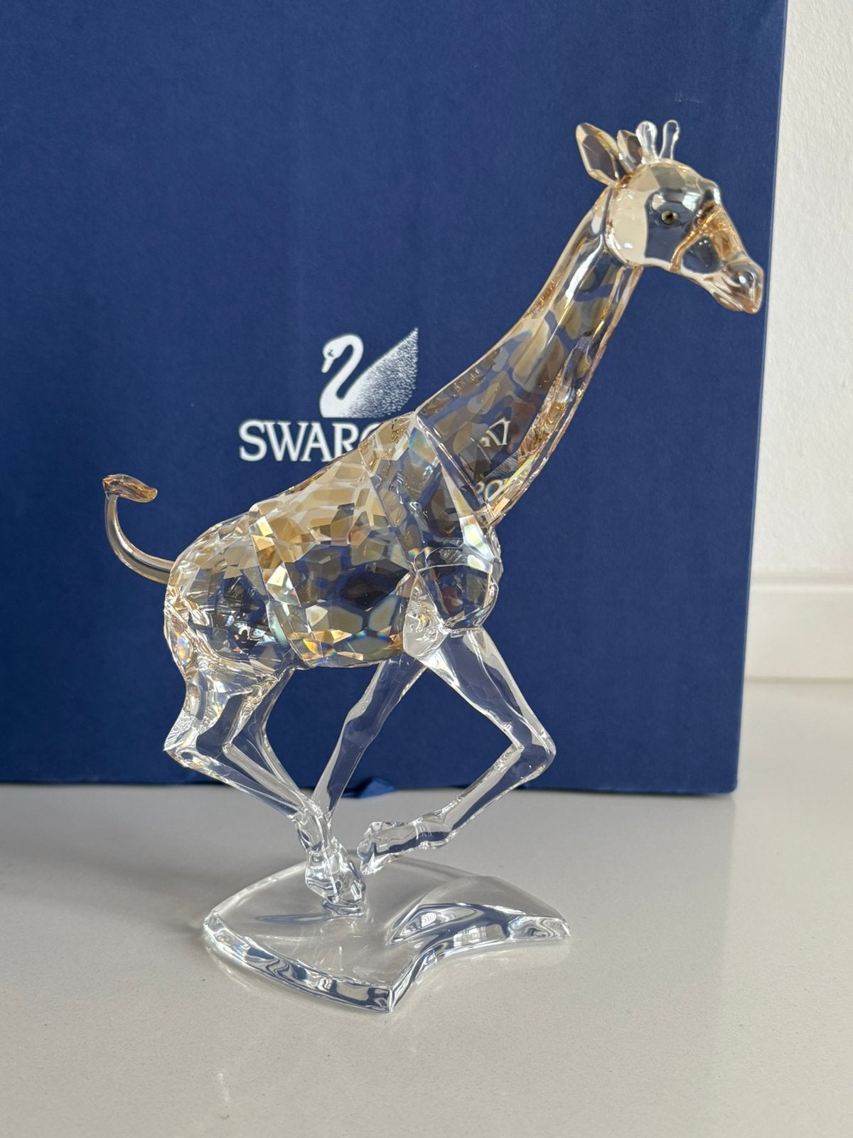 Swarovski rennende giraffe, Ophalen of Verzenden, Zo goed als nieuw, Figuurtje