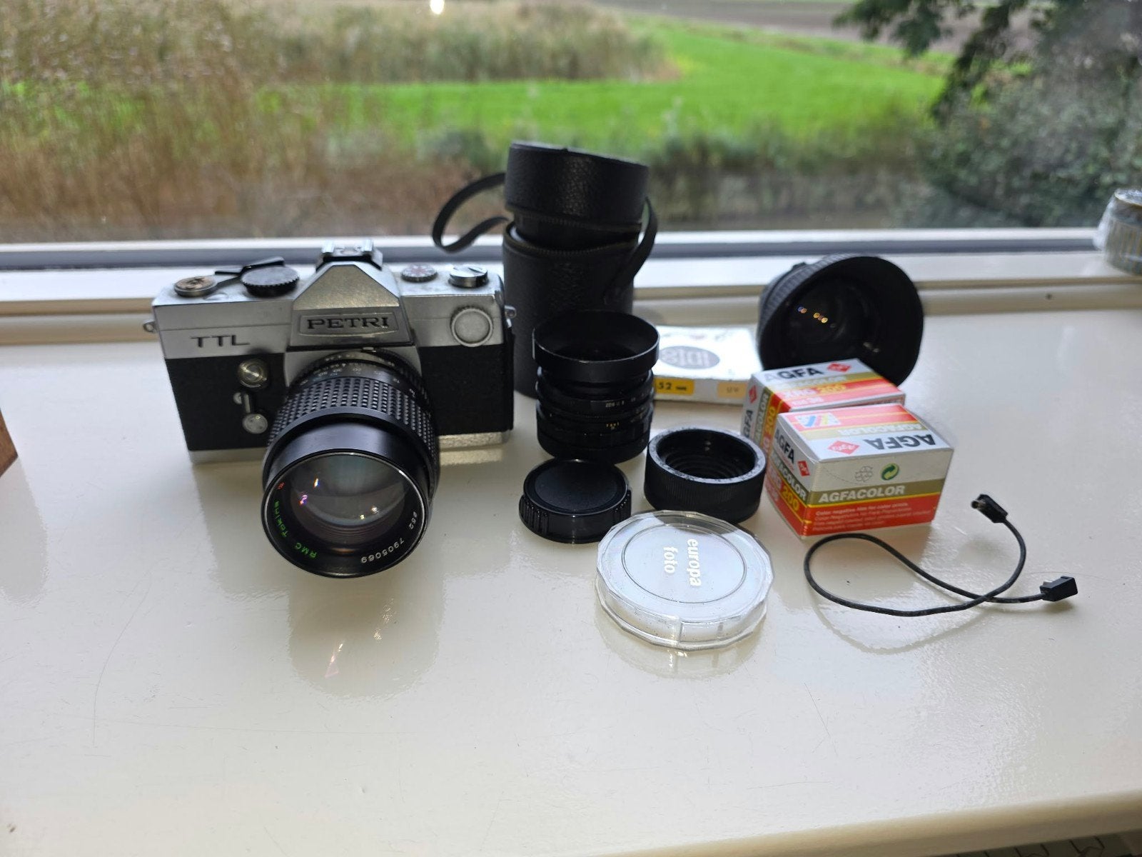 Petri TTL Spiegelreflexcamera met accessoires en lenzen, Ophalen of Verzenden