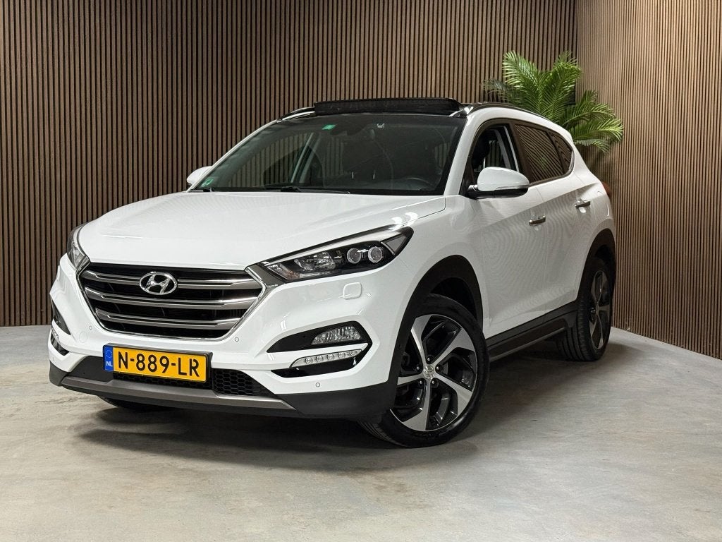 Hyundai Tucson 1.6 T-GDi Prem. 4WD (bj 2016, automaat), Gebruikt, 4 cilinders, Wit, Leder