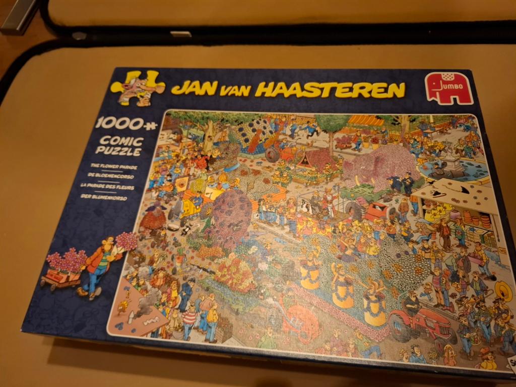 Te koop jan van haasteren puzzel de bloemencorso, Ophalen of Verzenden, 500 t/m 1500 stukjes, Zo goed als nieuw, Legpuzzel