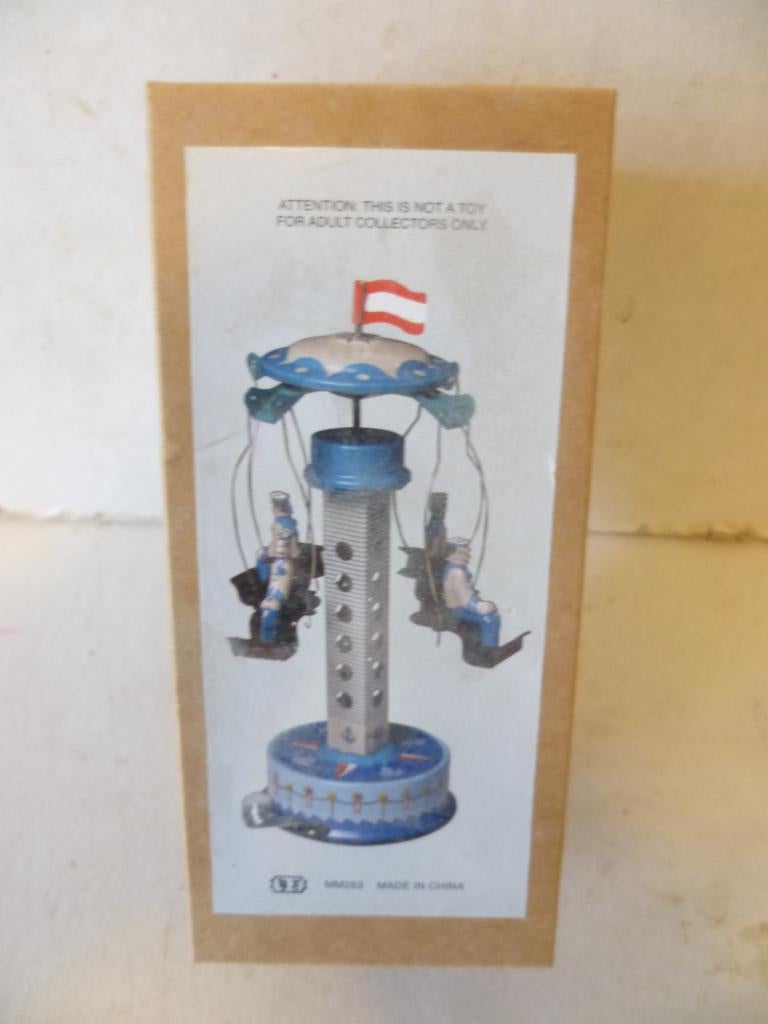 Blikken Draaimolen in doos 15cm hoog in nieuwstaat., Antiek en Kunst, Antiek | Speelgoed, Ophalen of Verzenden