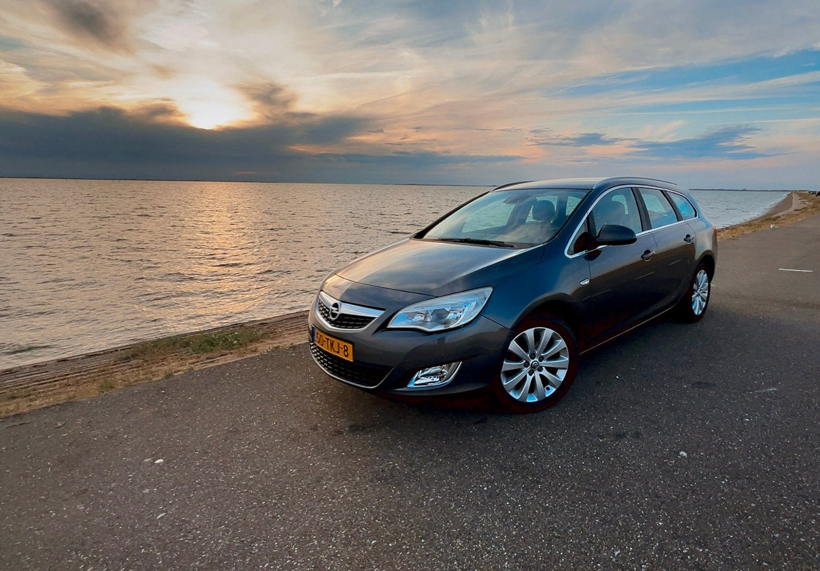 Opel Astra 1.4 Tourer Turbo 103KW 5D AUT 2012 Grijs, Auto's, Opel, Automaat, Euro 5, Zwart, 4 cilinders
