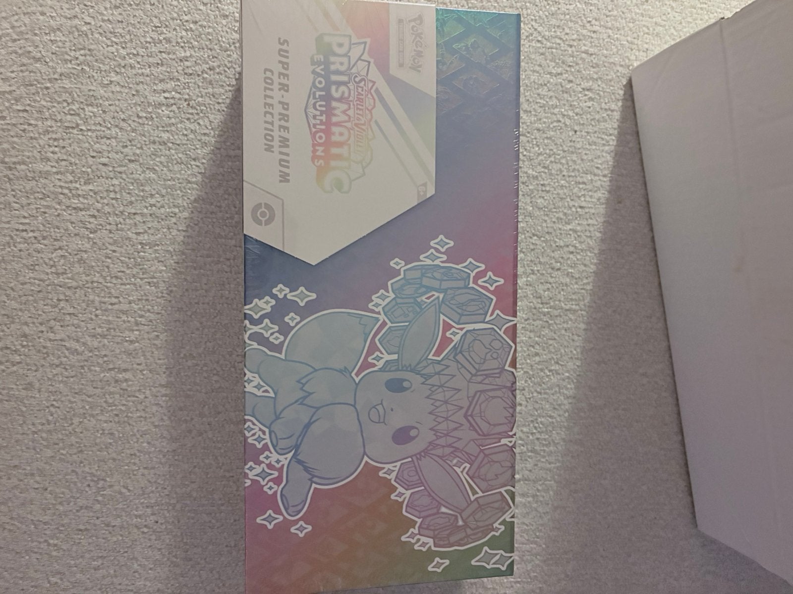 Pokémon Prismatic Evolutions  super premium collection SPC, Hobby en Vrije tijd, Ophalen of Verzenden, Nieuw, Boosterbox