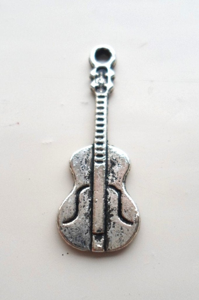 Hanger in de vorm van gitaar., Ophalen of Verzenden, Zo goed als nieuw, Zilver, Overige materialen