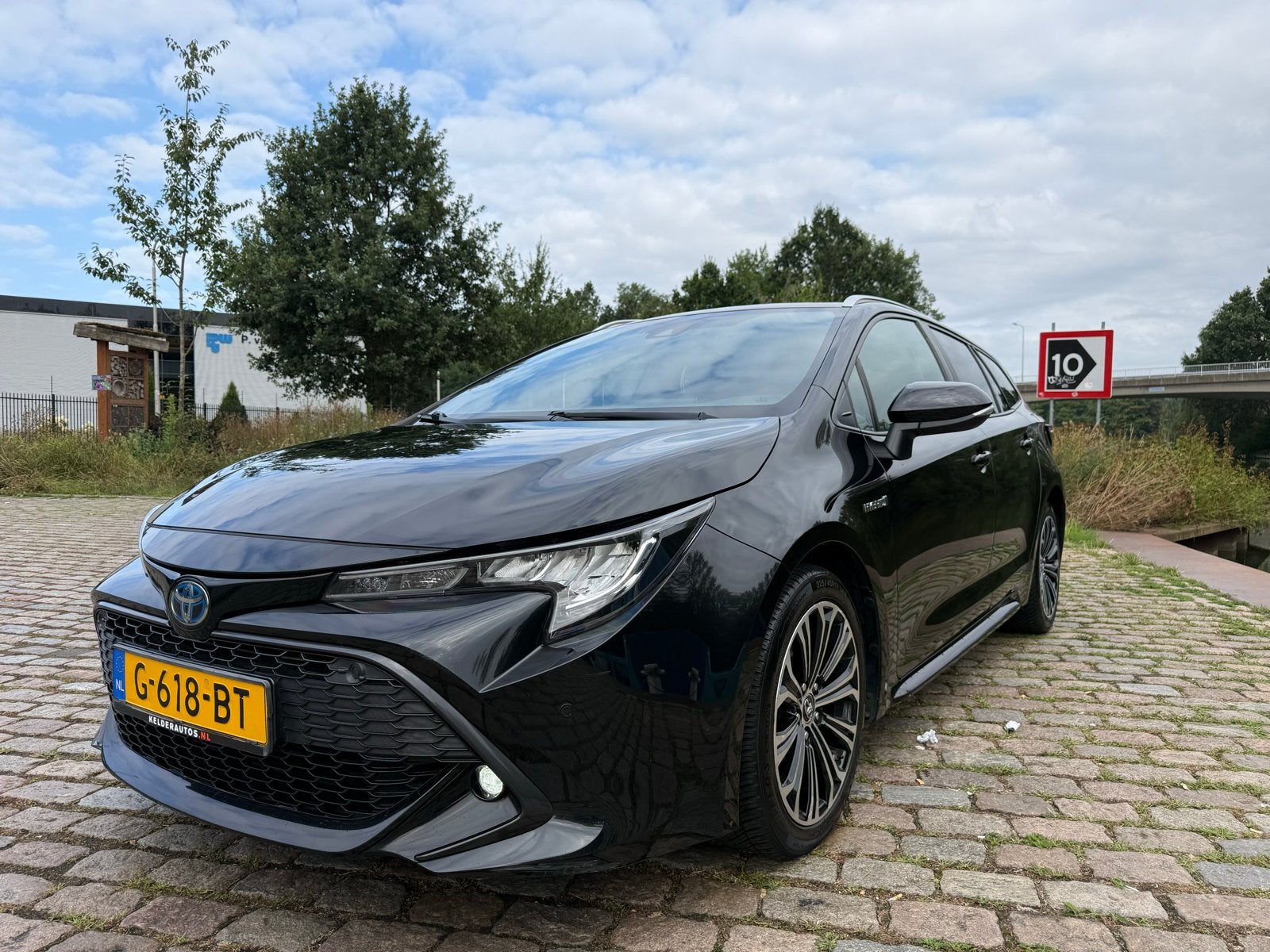 Toyota Corolla TS 1.8 Hybrid 122pk CVT 2019 Zwart, Auto's, 450 kg, 750 kg, Zwart, Stationwagon