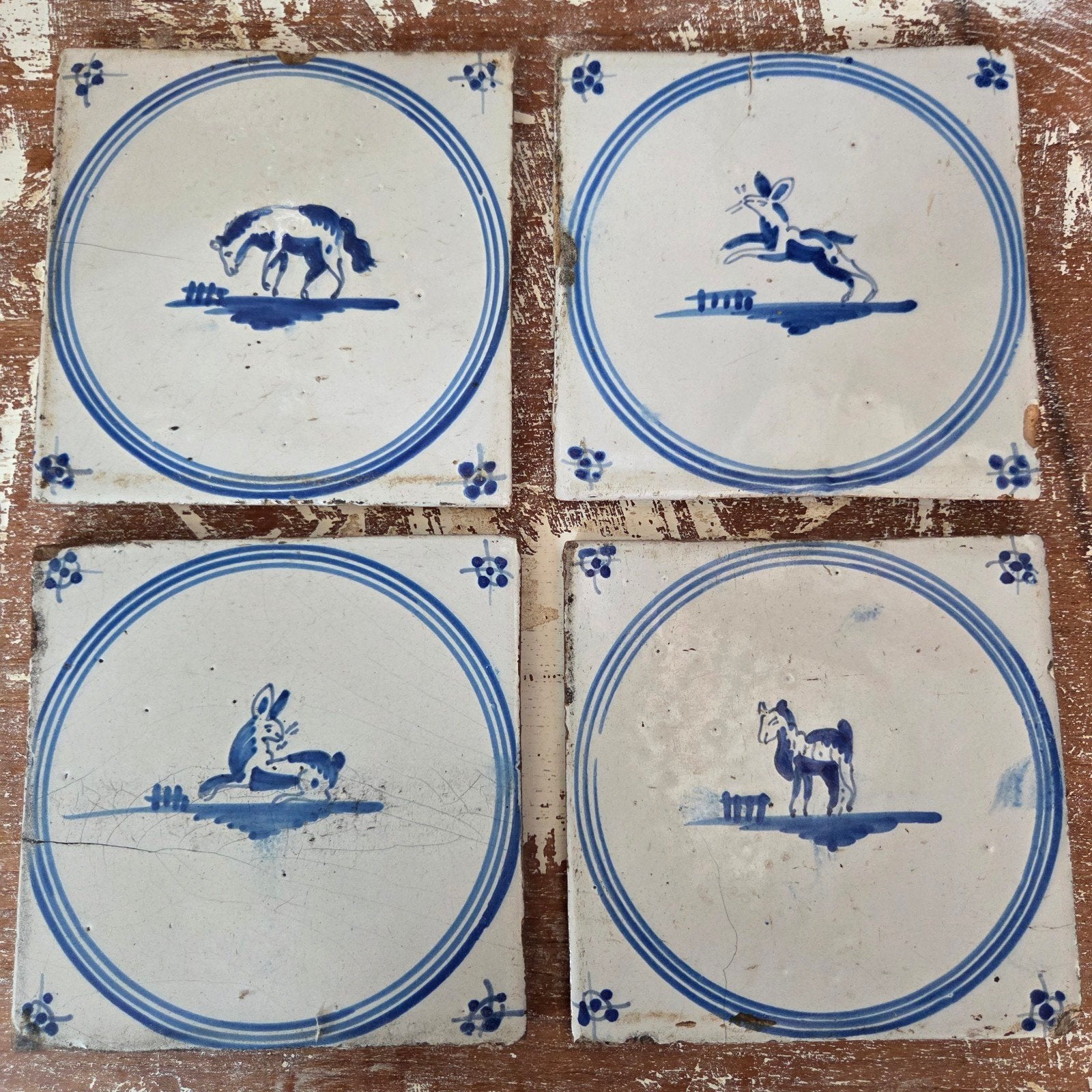 Set van 4 antieke Hollandse Delfts blauwe tegels met dieren, Ophalen of Verzenden
