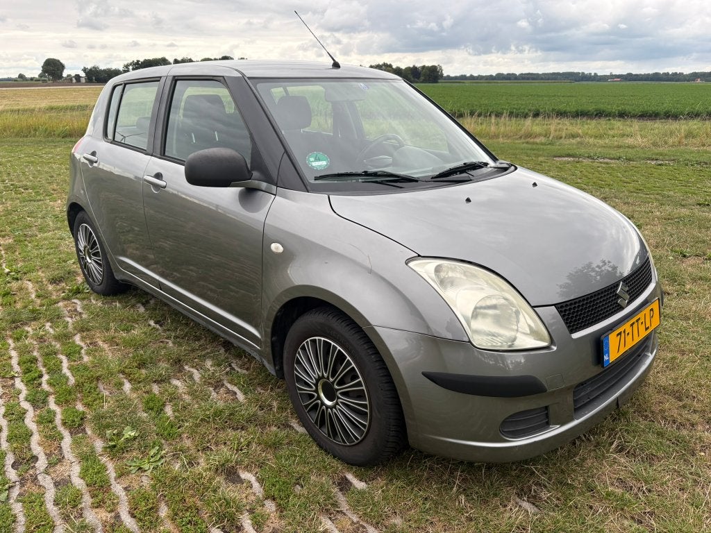 Suzuki Swift 1.5 5D AUT 2007 Grijs, Auto's, Dealer onderhouden, Stof, 40 €/maand, Zwart