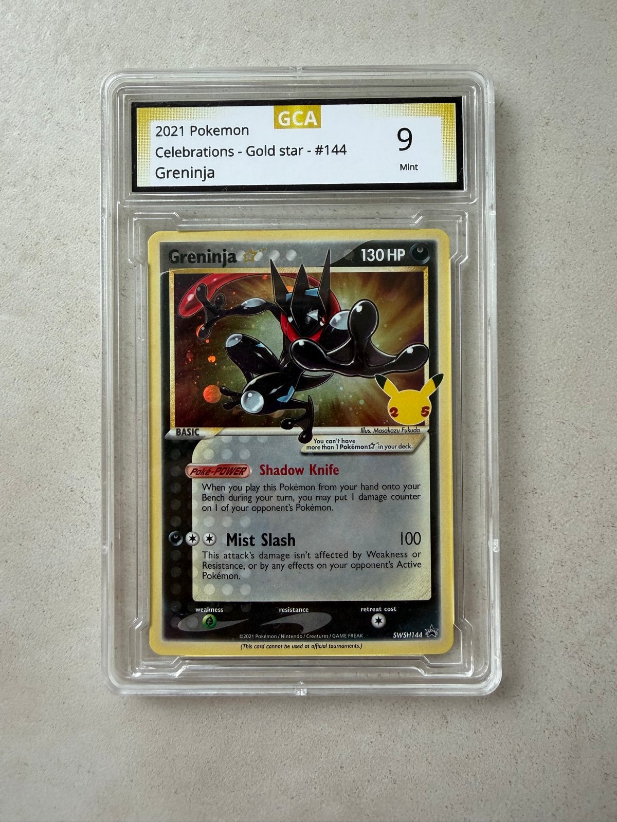 GCA 9 Mint Greninja Gold Star #144 Pokémon Celebrations, Ophalen of Verzenden, Zo goed als nieuw, Losse kaart