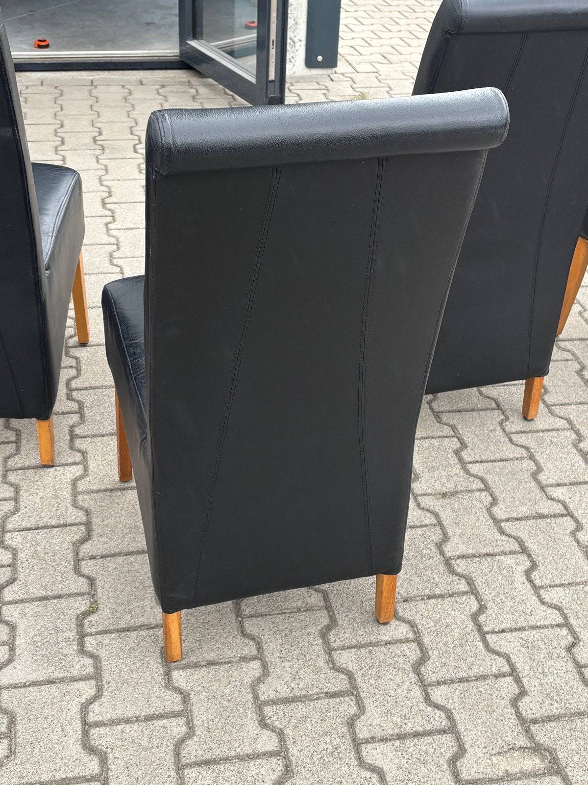 Set van 4 zwarte leren eetkamerstoelen met houten poten, Ophalen, Gebruikt, Zwart, Leer