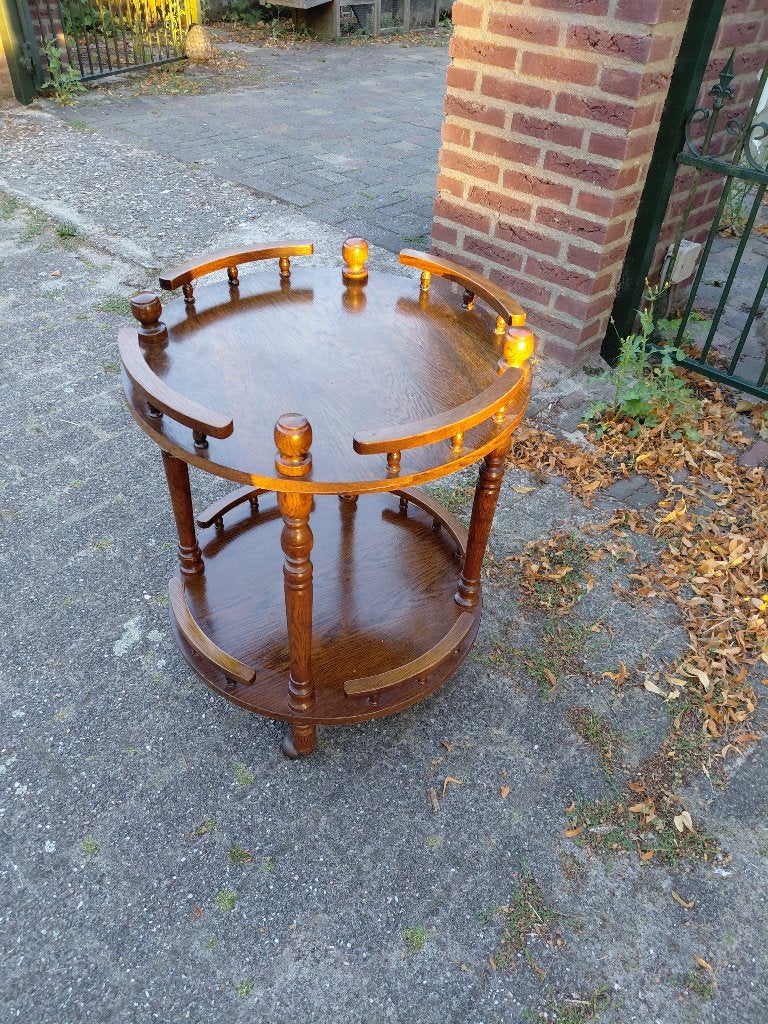 Eikenhouten ronde theewagen., Ophalen