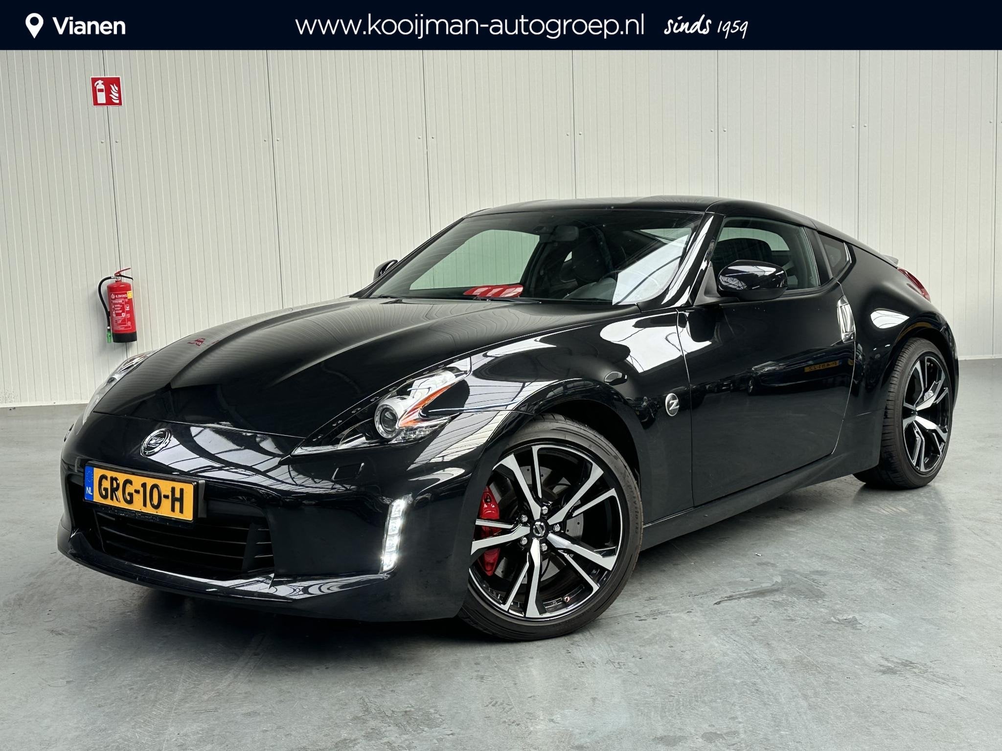 Nissan 370Z 3.7 V6 Pack Nette staat! keurige auto en Full Op, Auto's, Achterwielaandrijving, Gebruikt, Leder en Stof, Zwart