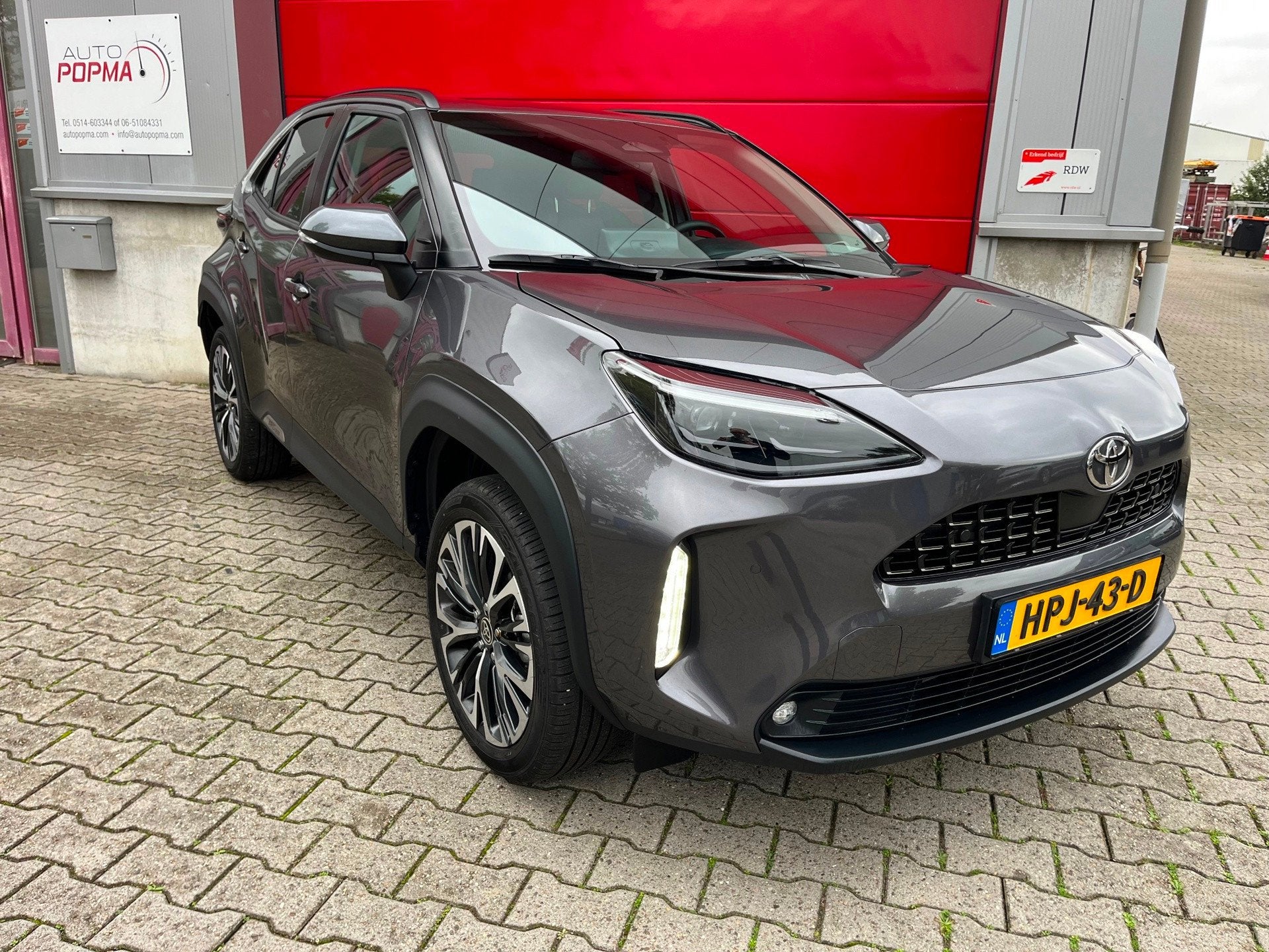 Toyota Yaris Cross 1.5 Hybrid 130 Executive Automaat / Adapt, Auto's, Dealer onderhouden, 1195 kg, Gebruikt, Leder en Stof