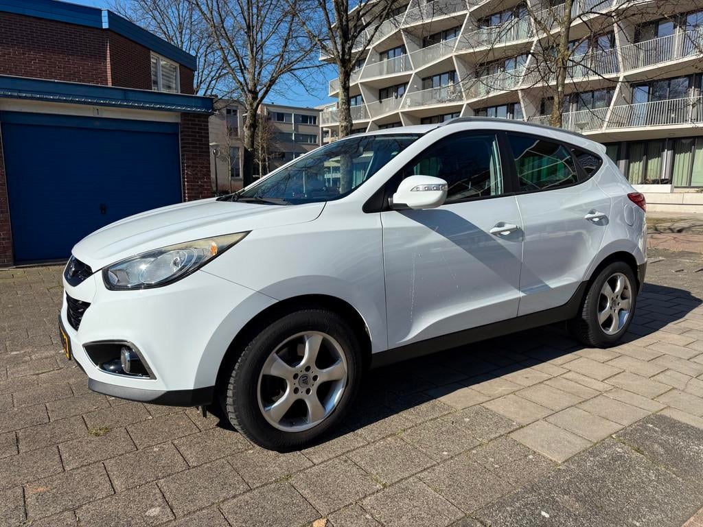 Hyundai Ix35 2.0i Business Edition Leder Cruise Snow White, Zwart, 4 cilinders, Leder en Stof, Origineel Nederlands