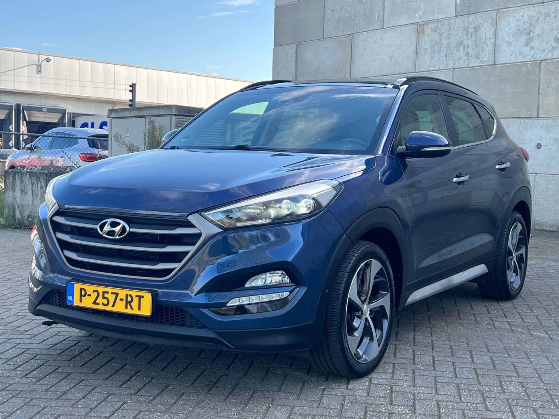 Hyundai Tucson 1.6 T-GDi Premium 4WD panorama dak automaat, Auto's, Dealer onderhouden, Gebruikt, 4 cilinders, Blauw