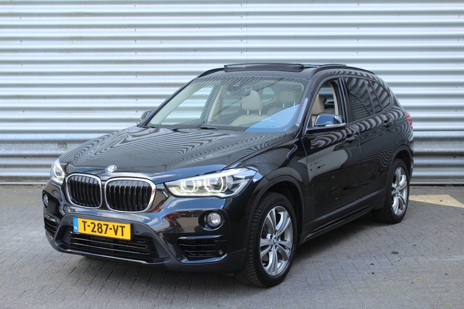 BMW X1 SDrive18i 140pk High Executive AUTOMAAT Panoramadak, Gebruikt, Zwart, Leder, Bedrijf