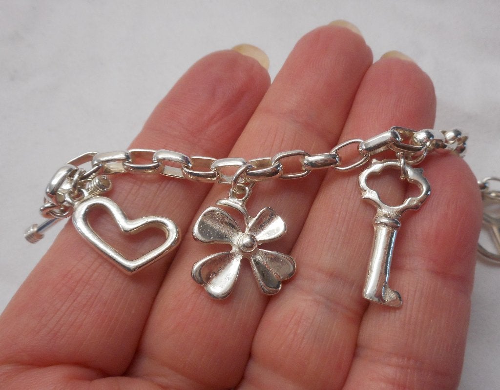 Zilveren bedel armband met 7 mooie bedels nr.114, Verzenden, Zo goed als nieuw, Met bedels of kralen, Zilver