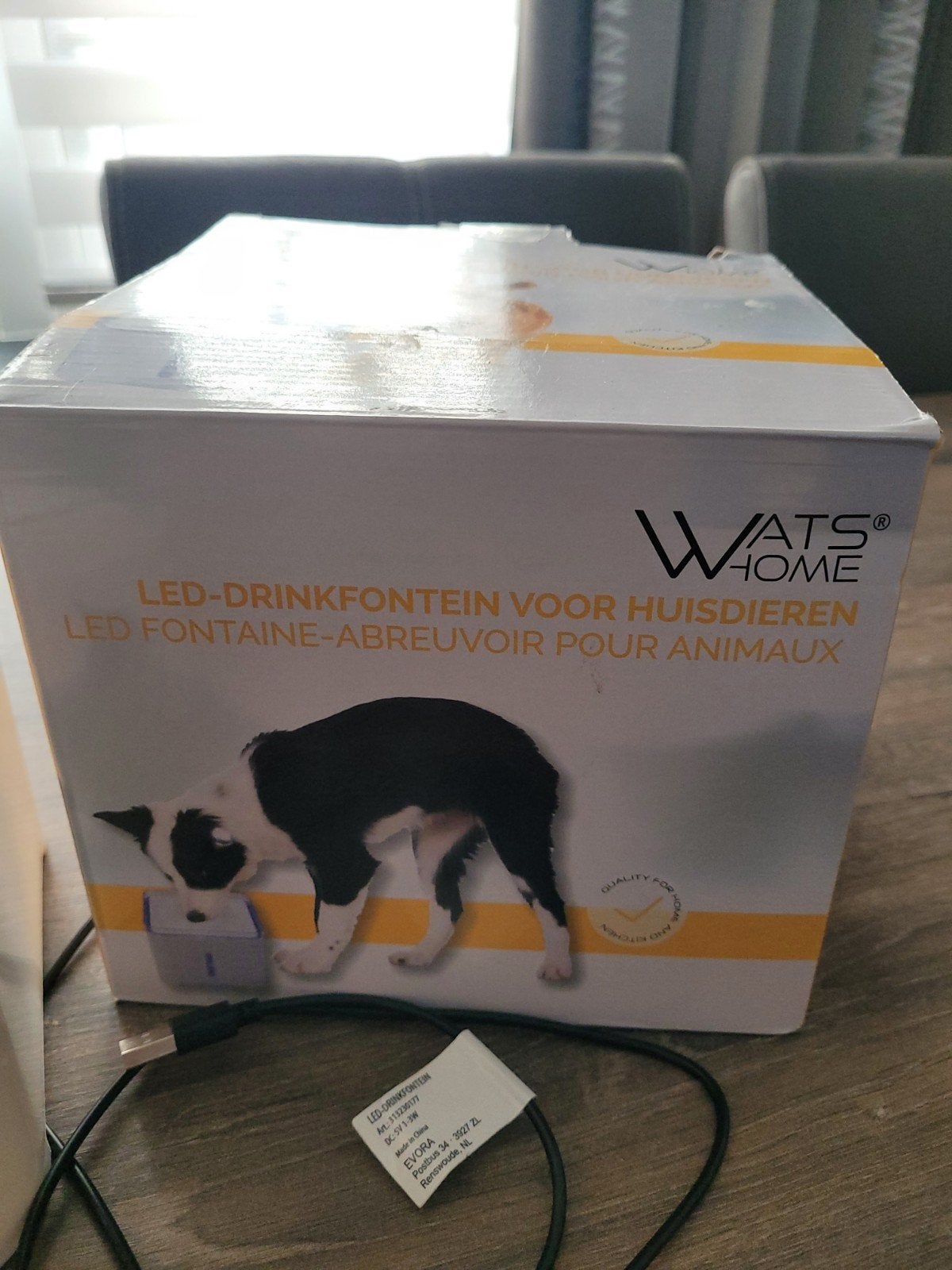drinkfontein voor  een kat, Ophalen