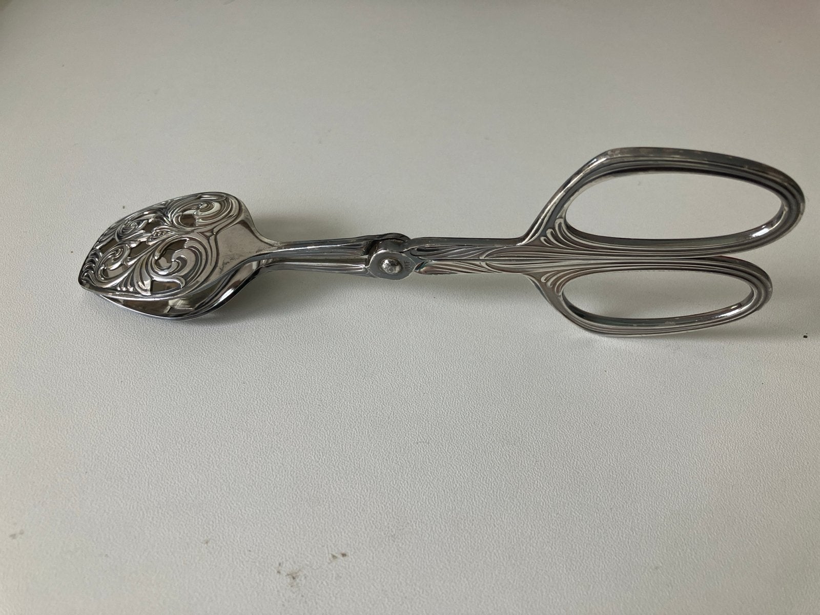 Antieke zilveren suikertang met sierlijk decor, Ophalen of Verzenden