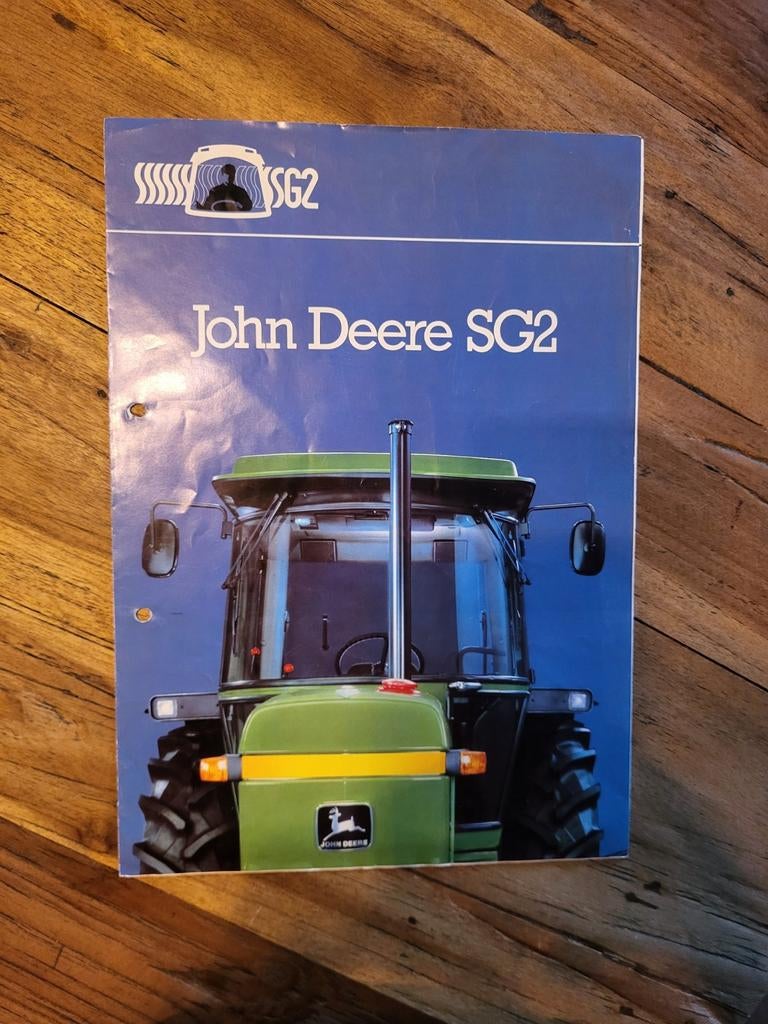 tractor folder John Deere SG2, Ophalen of Verzenden, Zo goed als nieuw