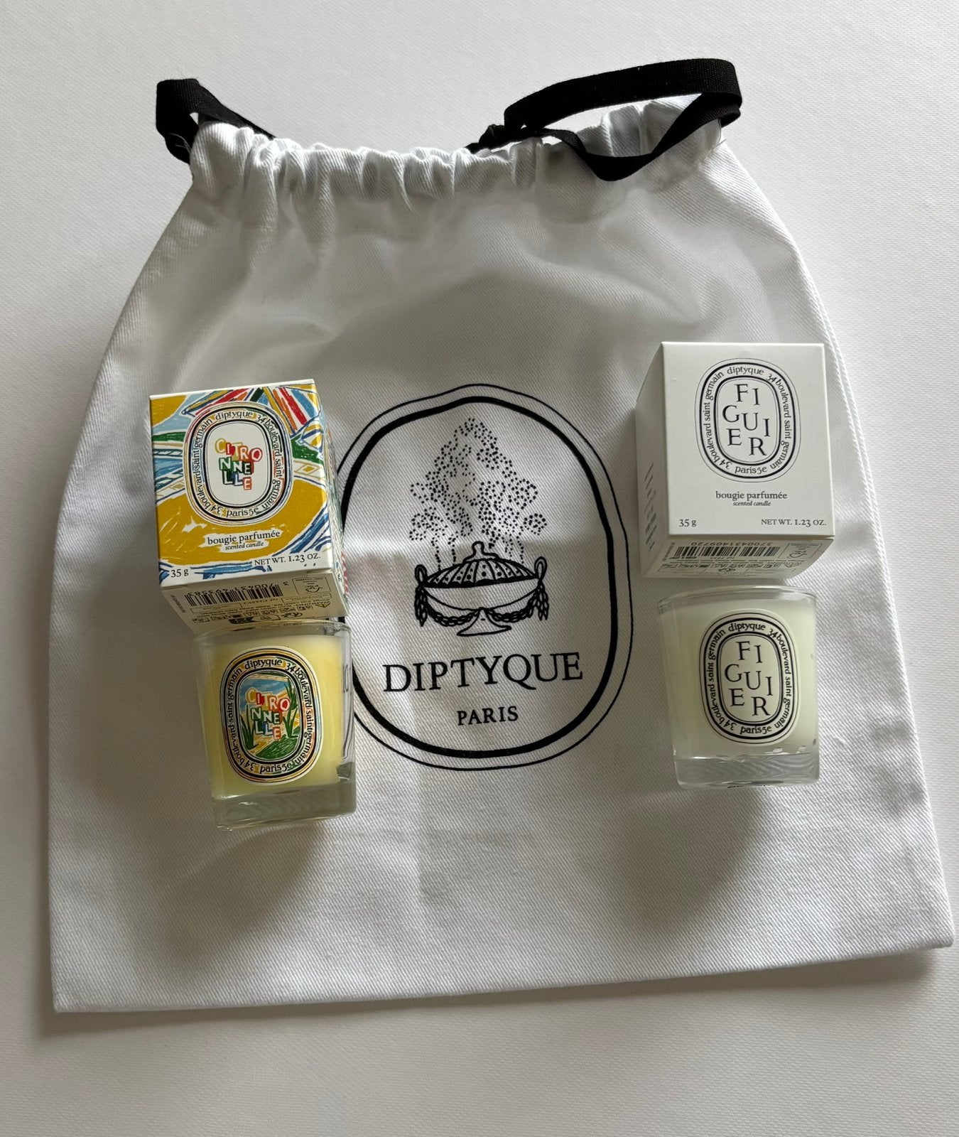 Diptyque 2 mini kaarsen + dustbag Nieuw, Huis en Inrichting, Verzenden, Nieuw, Kaars, Overige merken