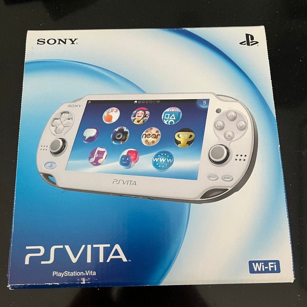 Sony PlayStation Vita OLED 1000 Wit in doos, Japans model, Spelcomputers en Games, Ophalen of Verzenden, Zo goed als nieuw, Wit