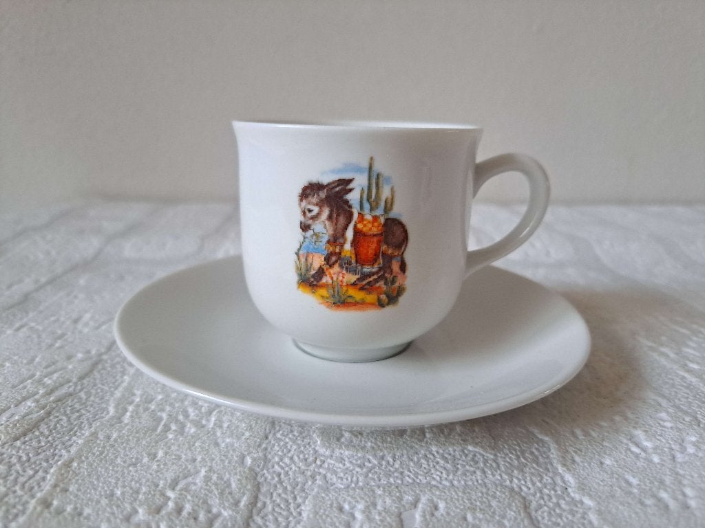 Kop en schotel Ezel met mand porselein D13.5x7.5cm, Nieuw, Ophalen of Verzenden, Overige stijlen, Kop(pen) en/of Schotel(s)