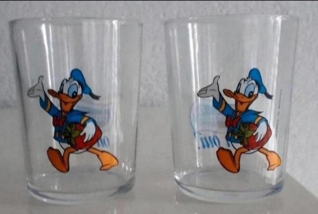 Set van 2 Donald Duck Chambourcy 'Oh Oui!' glazen, Verzamelen, Ophalen of Verzenden, Donald Duck, Zo goed als nieuw, Servies