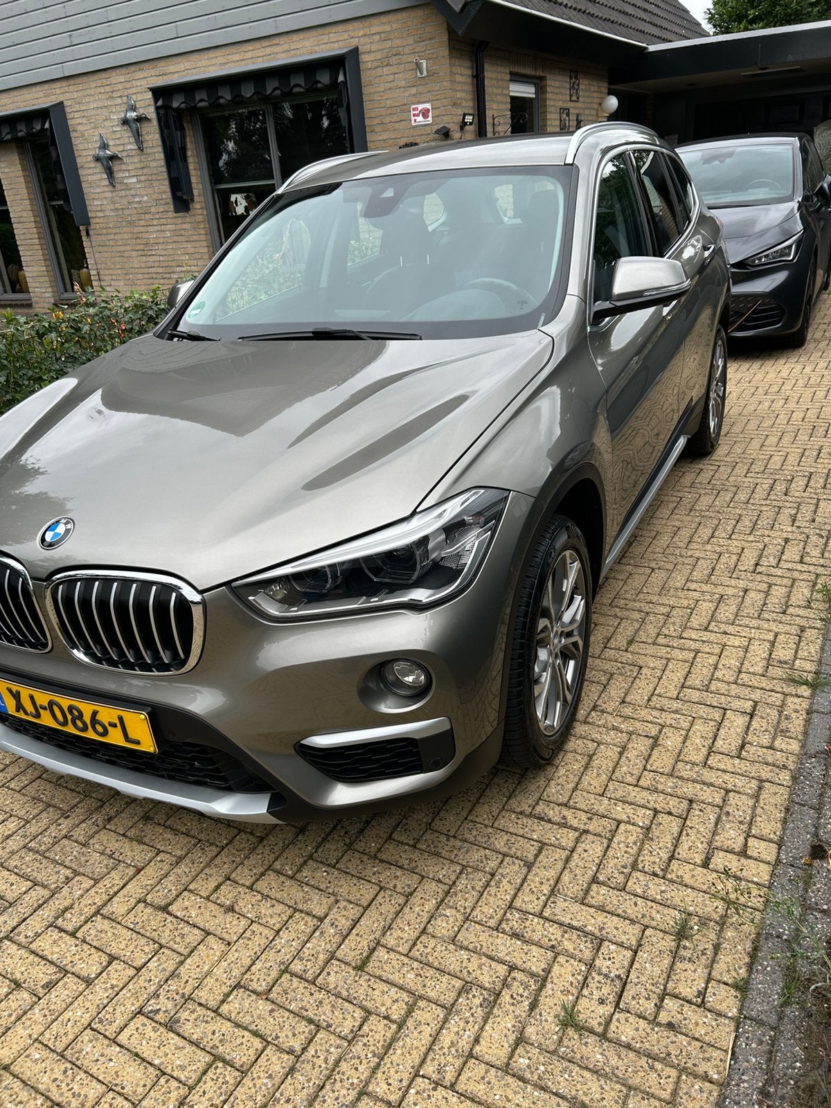 BMW X1 Sdrive20i 192pk Aut 2019 Grijs automaat trekhaak, Auto's, 1998 cc, 1800 kg, Zwart, Particulier